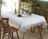 White lace embroidery tablecloth with intricate floral patterns and scalloped edges. Ideal for dining tables, weddings, and special occasions.