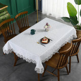 Battilo lace embroidery tablecloth with floral design on a dining table. Waterproof and elegant, perfect for weddings, parties, and home decor.