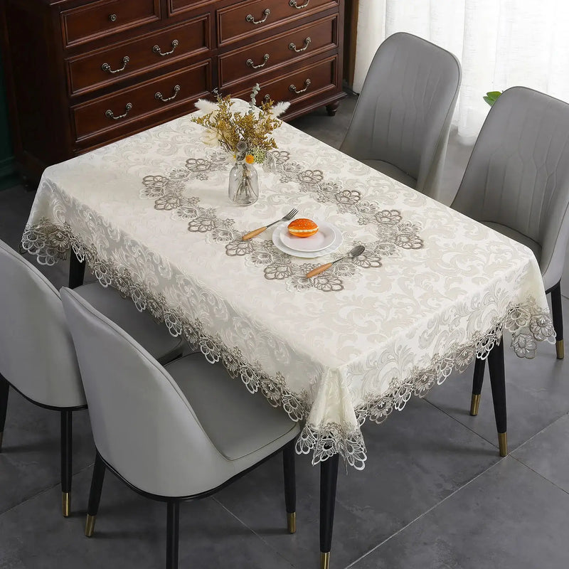 Battilo lace embroidery tablecloth with floral design on a dining table. Waterproof and elegant, perfect for weddings, parties, and home decor.