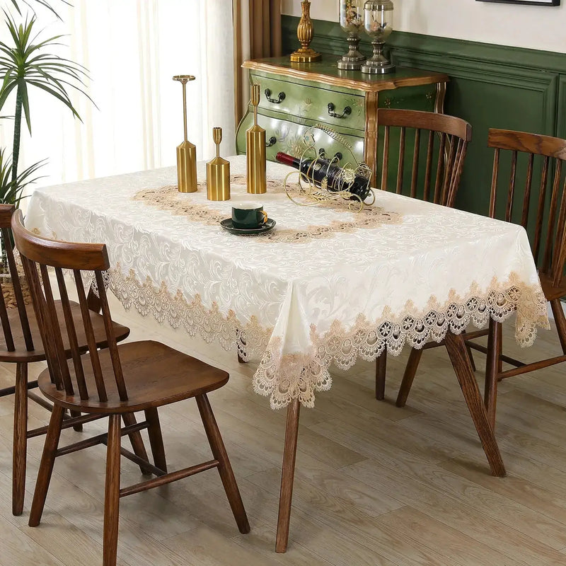 Ivory lace embroidery tablecloth with floral patterns on a dining table. Elegant and waterproof, suitable for weddings and home decor.