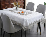 Battilo lace embroidery tablecloth with floral design on a dining table. Waterproof and elegant, perfect for weddings, parties, and home decor.