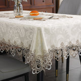 Battilo lace embroidery tablecloth with floral design on a dining table. Waterproof and elegant, perfect for weddings, parties, and home decor.