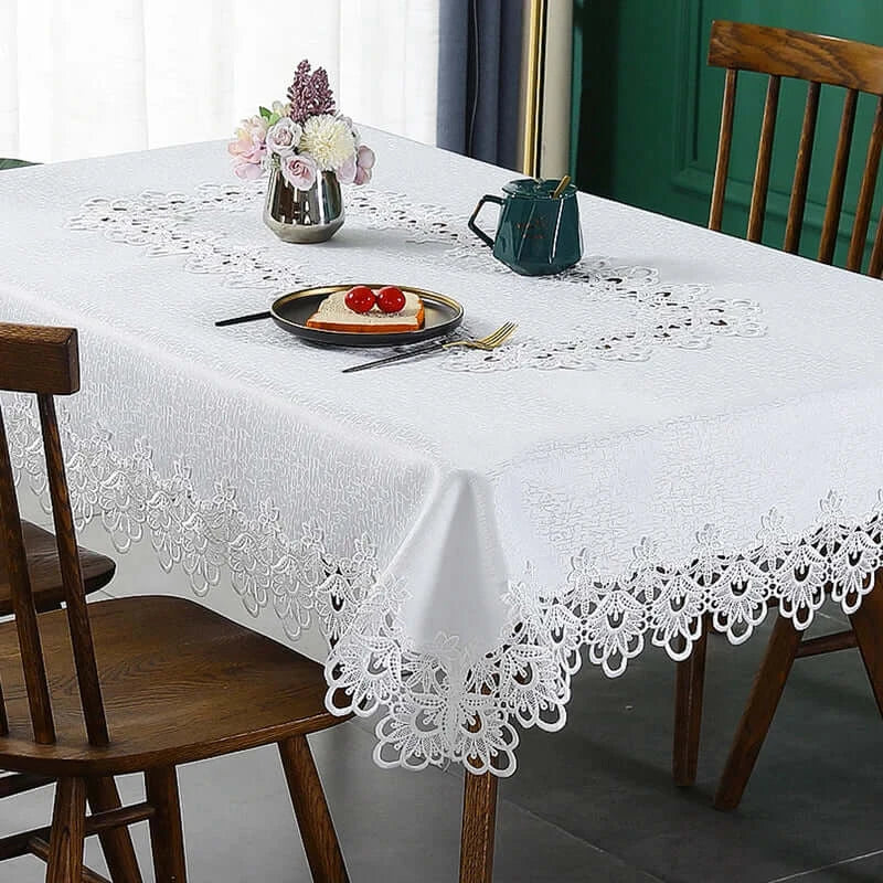 Battilo lace embroidery tablecloth with floral design on a dining table. Waterproof and elegant, perfect for weddings, parties, and home decor.