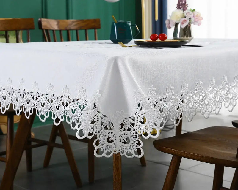 Battilo lace embroidery tablecloth with floral design on a dining table. Waterproof and elegant, perfect for weddings, parties, and home decor.