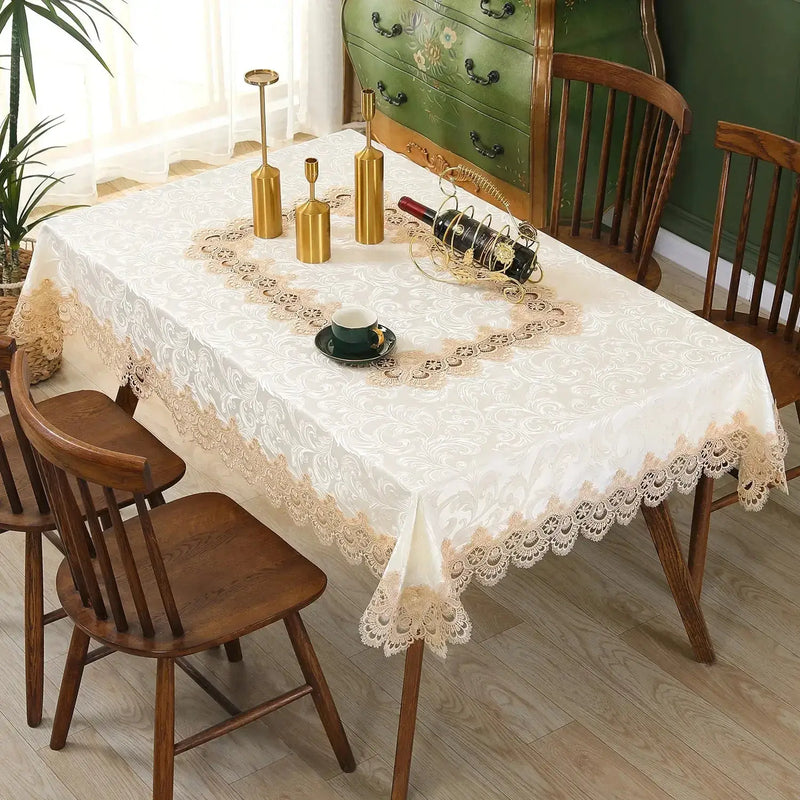 Ivory lace embroidery tablecloth with floral patterns on a dining table. Elegant and waterproof, suitable for weddings and home decor.