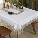 Battilo lace embroidery tablecloth with floral design on a dining table. Waterproof and elegant, perfect for weddings, parties, and home decor.