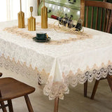 Beige lace embroidery tablecloth with intricate floral designs on a wooden dining table. Waterproof and perfect for elegant dining settings.