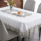 White lace embroidery tablecloth with intricate floral patterns and scalloped edges. Ideal for dining tables, weddings, and special occasions.