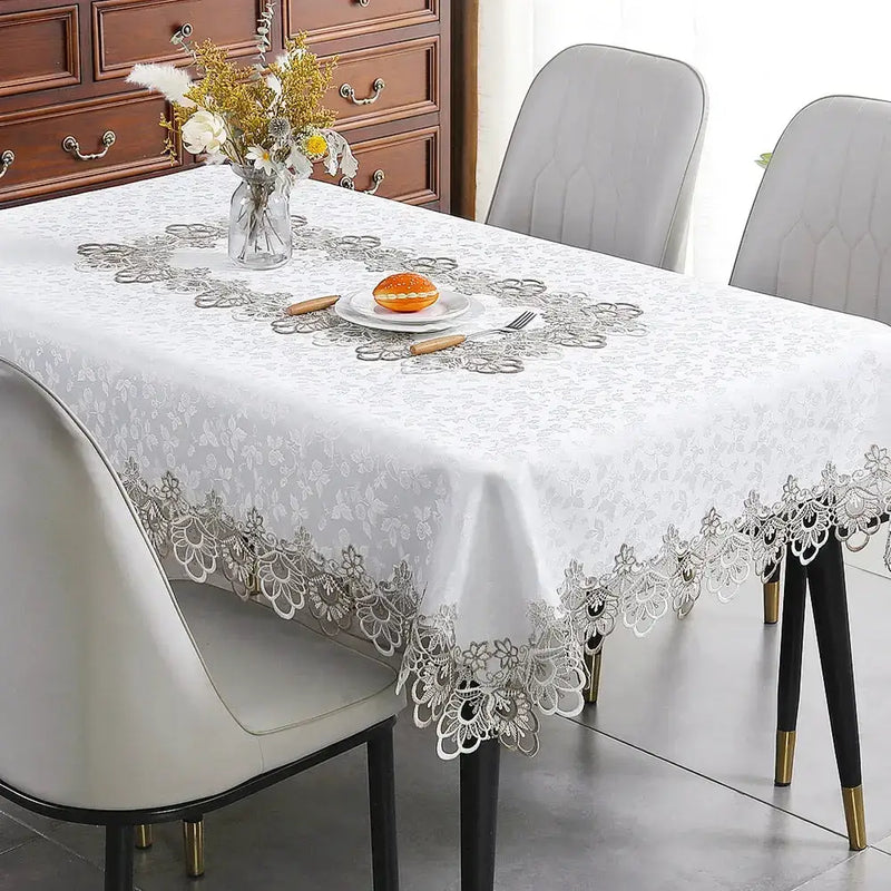 Battilo lace embroidery tablecloth with floral design on a dining table. Waterproof and elegant, perfect for weddings, parties, and home decor.