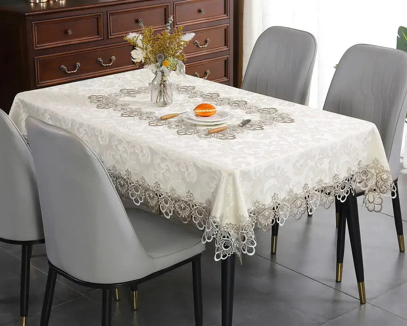 Battilo lace embroidery tablecloth with floral design on a dining table. Waterproof and elegant, perfect for weddings, parties, and home decor.