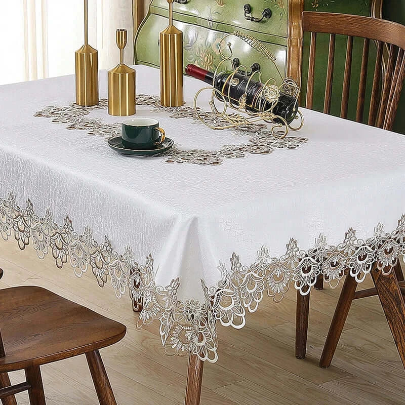 Battilo lace embroidery tablecloth with floral design on a dining table. Waterproof and elegant, perfect for weddings, parties, and home decor.